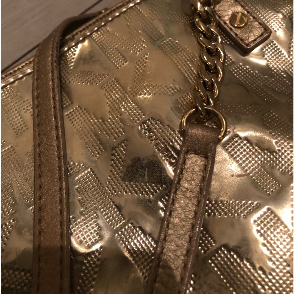 Metallic gold purse with chain 
Michael Kors